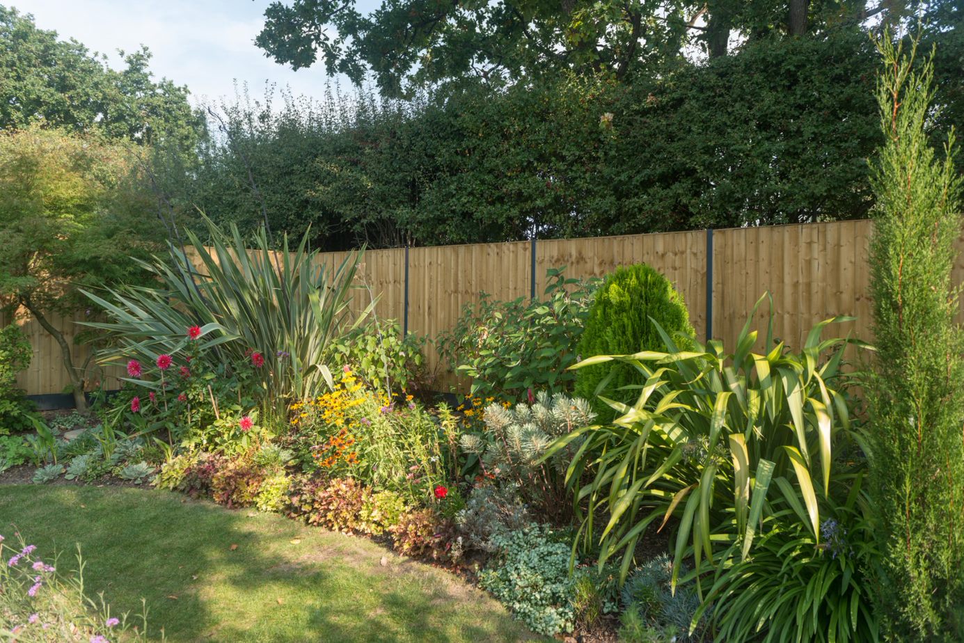 Vertical board panels with Durapost steel posts